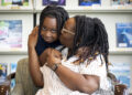 Jaleel Montgomery with his mom Mikole after a tutoring session at the Missouri City Branch Library.