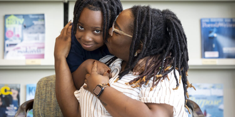 Jaleel Montgomery with his mom Mikole after a tutoring session at the Missouri City Branch Library.