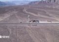 aerial shot of Nazca lines, line drawings in desert sand