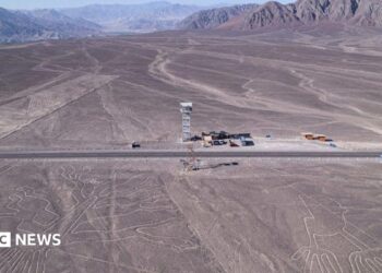 aerial shot of Nazca lines, line drawings in desert sand