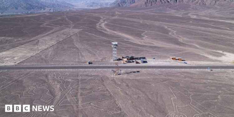 aerial shot of Nazca lines, line drawings in desert sand