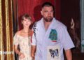 Taylor Swift and Travis Kelce were seen walking out of a restaurant on their wedding weekend in New York City. She is wearing a floral dress and he is seen in a short-sleeved button-down shirt and pants.