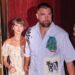 Taylor Swift and Travis Kelce were seen walking out of a restaurant on their wedding weekend in New York City. She is wearing a floral dress and he is seen in a short-sleeved button-down shirt and pants.