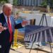 President Trump showing a rendering of the ballroom in front of construction materials on 19 May.