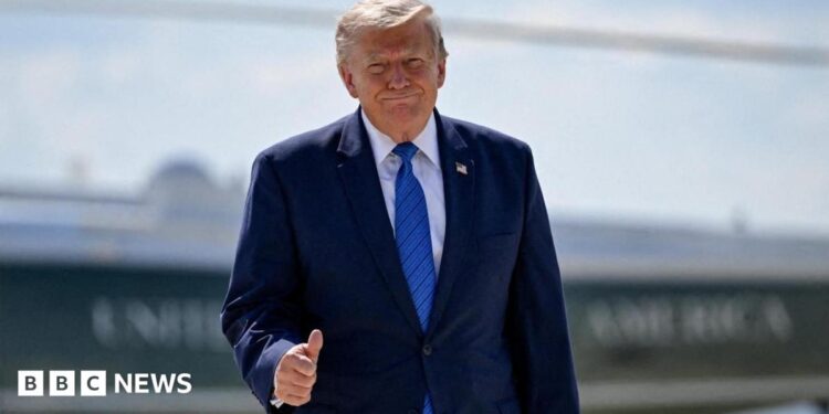 U.S. President Donald Trump gives thumbs-up as he walks from Marine One to board Air Force One.