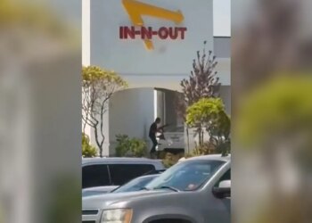 the scene of a shooting that started at an In-N-Out Burger restaurant