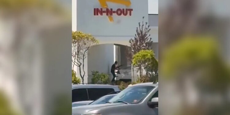 the scene of a shooting that started at an In-N-Out Burger restaurant