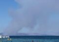 Smoke rises in Salamina during wildfire as seen from Agistri island