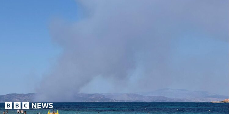 Smoke rises in Salamina during wildfire as seen from Agistri island