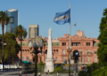 The Plaza de Mayo square in the heart of Buenos Aires, with an Argentinian flag shown flying in the foreground