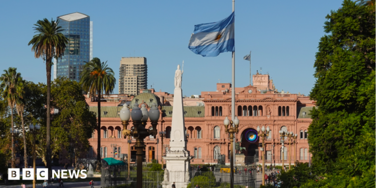 The Plaza de Mayo square in the heart of Buenos Aires, with an Argentinian flag shown flying in the foreground