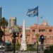 The Plaza de Mayo square in the heart of Buenos Aires, with an Argentinian flag shown flying in the foreground
