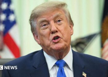 A close up shot of President Donald Trump speaking at the Oval Office.