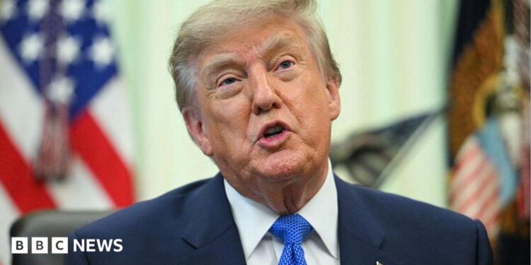 A close up shot of President Donald Trump speaking at the Oval Office.