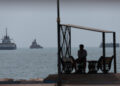 Vessels in the Strait of Hormuz are visible near the beach of Bandar Abbas