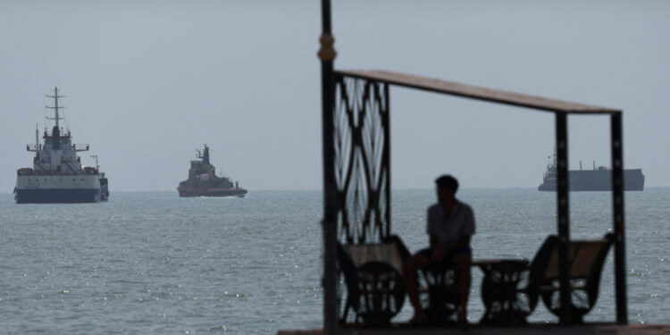 Vessels in the Strait of Hormuz are visible near the beach of Bandar Abbas