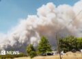 Smoke billows into the sky during a wildfire in Washington state