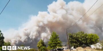 Smoke billows into the sky during a wildfire in Washington state