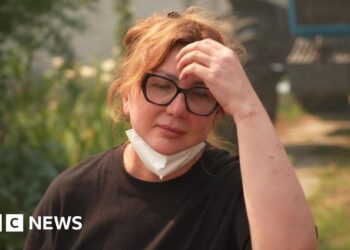 Anastasiia Dudley with her hand on her head