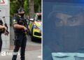 Police on left Kinahan on right