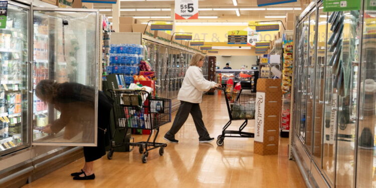 Food shoppers browse the aisles for groceries ahead of the Thanksgiving Day holiday in Redmond