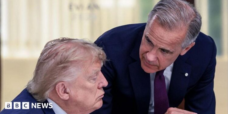 US President Donald Trump (left) speaks with Canada's Prime Minister Mark Carney during a work lunch as part of the G7 summit, in Evian, eastern France, on June 16, 2026. Trump is sitting down while Carney is standing over but leaning into the conversation.