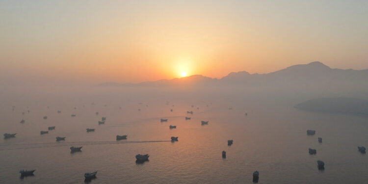 FILE PHOTO: A drone view shows vessels in the Strait of Hormuz, as seen from Musandam