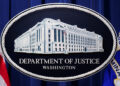 FILE PHOTO: U.S. Justice Department logo is seen at Justice Department headquarters in Washington