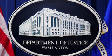 FILE PHOTO: U.S. Justice Department logo is seen at Justice Department headquarters in Washington