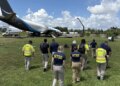 ntsb officials walk to plane crash site