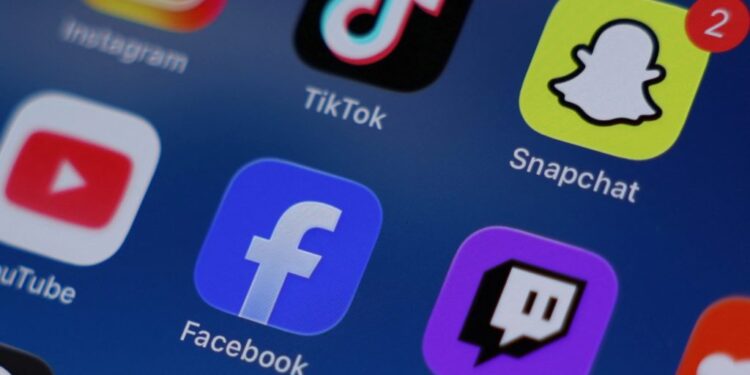 Social media apps are displayed on a mobile phone