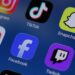 Social media apps are displayed on a mobile phone