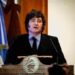 Argentine President speaks during a ceremony commemorating the 172nd anniversary of the Buenos Aires Stock Exchange in Buenos Aires, Argentina, July 16, 2026. He is wearing a dark suit with a black tie and a light blue shirt. He stands at a lectern and to his left there is an Argentine flag.