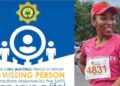 A poster from the South African police which reads: There is no waiting period to report a missing person, next to a photo of Elizabeth Moselakgomo. She is wearing a pink running top with a number pinned to it, along with a pink cap. She is smiling.