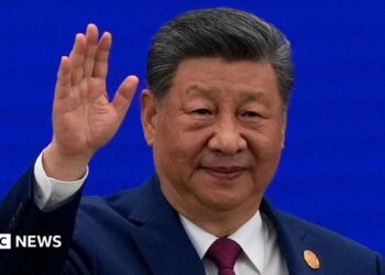 Chinese President Xi Jinping waves as he arrives at the opening ceremony for the World AI Conference on July 17, 2026 in Shanghai, China.