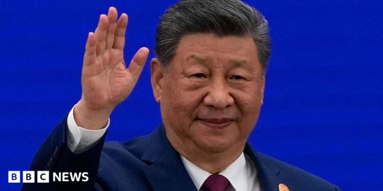 Chinese President Xi Jinping waves as he arrives at the opening ceremony for the World AI Conference on July 17, 2026 in Shanghai, China.