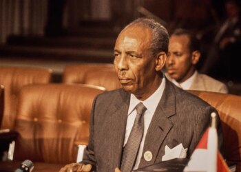 Mohammed Siad Barre stands for a portrait photograph.