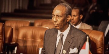 Mohammed Siad Barre stands for a portrait photograph.