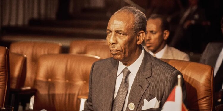 Mohammed Siad Barre stands for a portrait photograph.