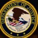 U.S. Department of Justice logo displayed on a podium.