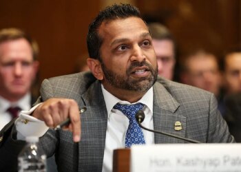 Kash Patel speaking at a witness table during a Senate committee hearing.