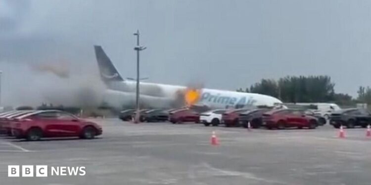 Prime Air plane nose down after crashing at Miami airport.