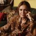Gloria Steinem lying on a couch