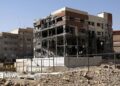 General view of a five-storey building in Tehran. The building has been shelled-out by a reported missile attack, the outer brickwork is no longer visible and instead the building is hollowed out but is still standing. It is surrounded by rubble