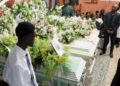 Relatives and residents attend the funeral of victims in Kenscoff