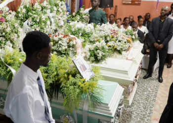 Relatives and residents attend the funeral of victims in Kenscoff
