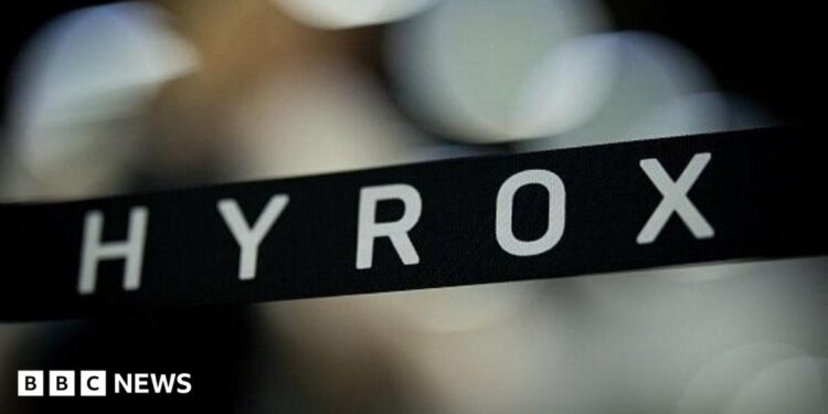 A stock image with a banner showing the name Hyrox over an out-of-focus background.