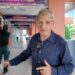 BBC correspondent Jonathan Head and a man dressed in black standing in a school corridor in Bangkok