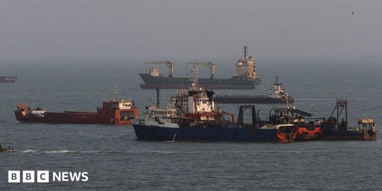 File photo showing commercial ships anchored in the Strait of Hormuz, off the coast of Bandar Abbas, Iran (10 August 2026)