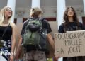 Activists holding placards take part in a rally in support of introducing a moratorium on the public use of Russian-language cultural products on July 8, 2026 in Odesa, Ukraine